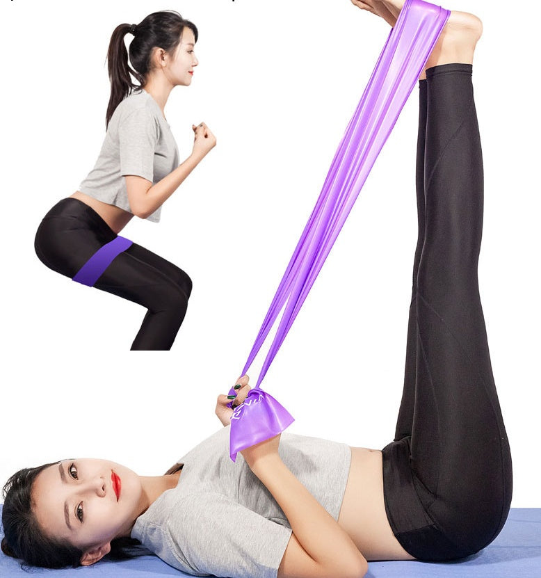 Woman exercising with purple yoga fitness resistance band for strength training