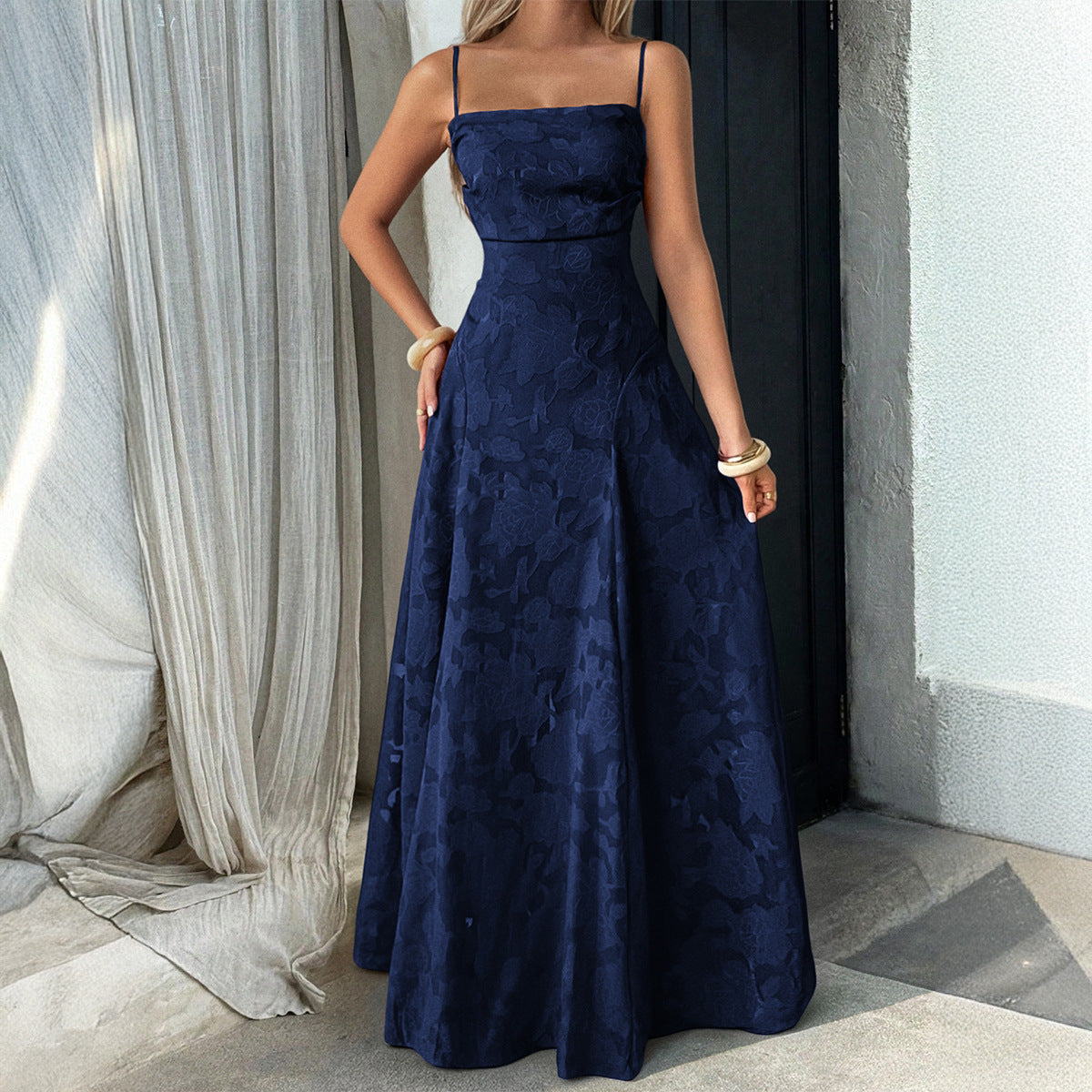 Elegant navy blue strapless maxi dress with subtle floral pattern and A-line silhouette for vacation and formal occasions