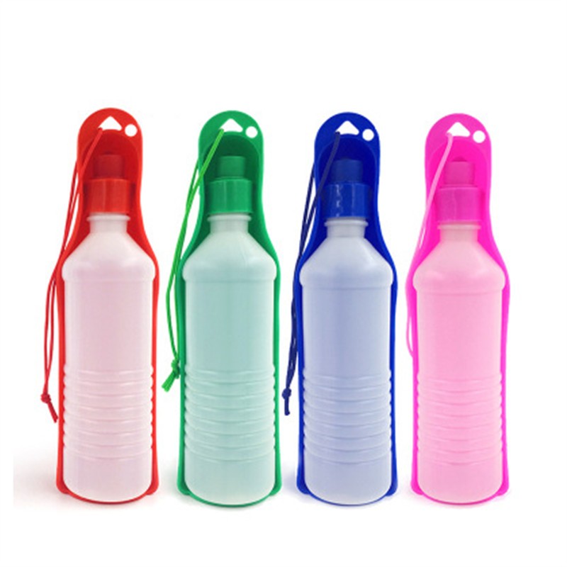 Portable water bottle for dogs with attached silicone bowl in red, green, blue, and pink colors for easy pet hydration on the go