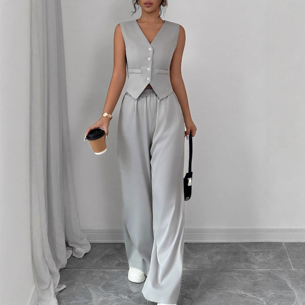 Gray elegant button-front sleeveless vest paired with matching full-length trousers for commuter style